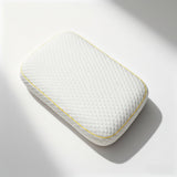 Overhead view of the Pillowash Crisp pillow showing the full honeycomb top panel framed by yellow piping